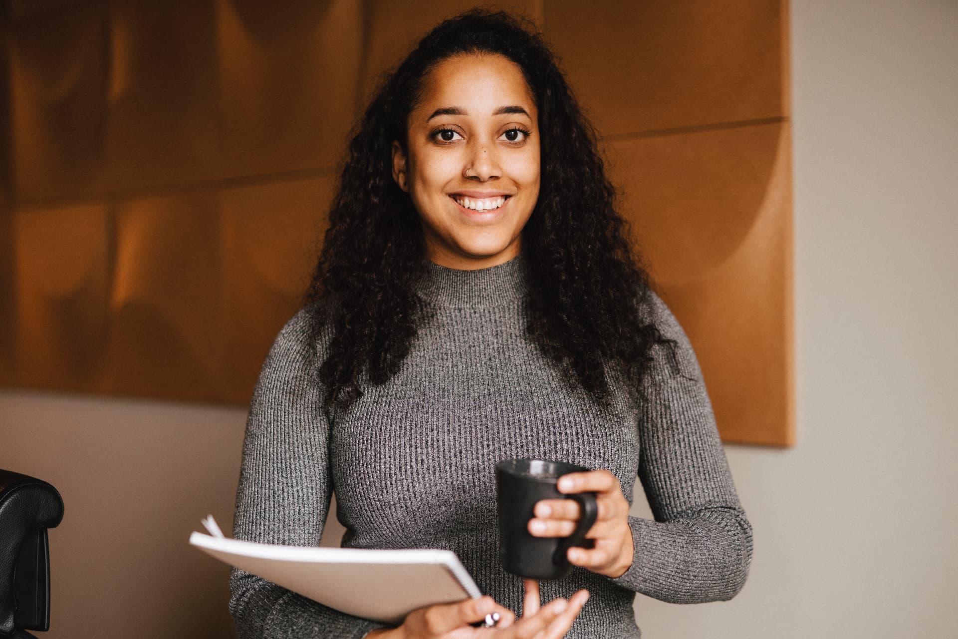 Woman reflecting with a cup of coffee